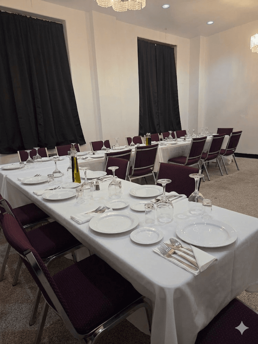 A festive banquet-style dinner set up in the hall.